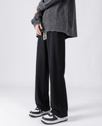 Black cotton straight leg sweatpants side view on tall model