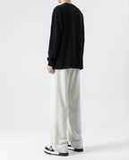 White cotton straight leg sweatpants back view on tall model