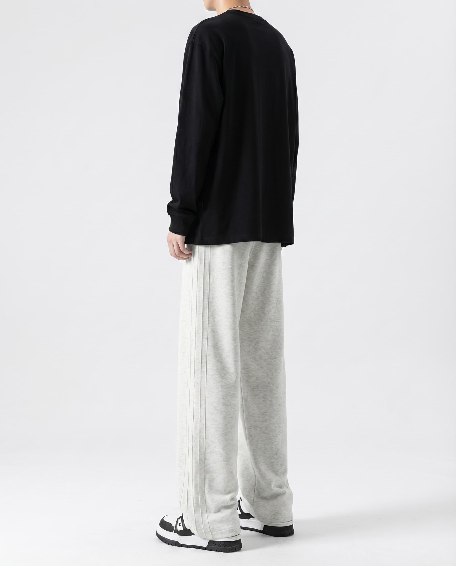 White cotton straight leg sweatpants back view on tall model