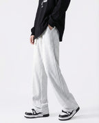 White cotton straight leg sweatpants front view on tall model