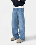 Light blue relaxed fit jeans close-up front view on tall model