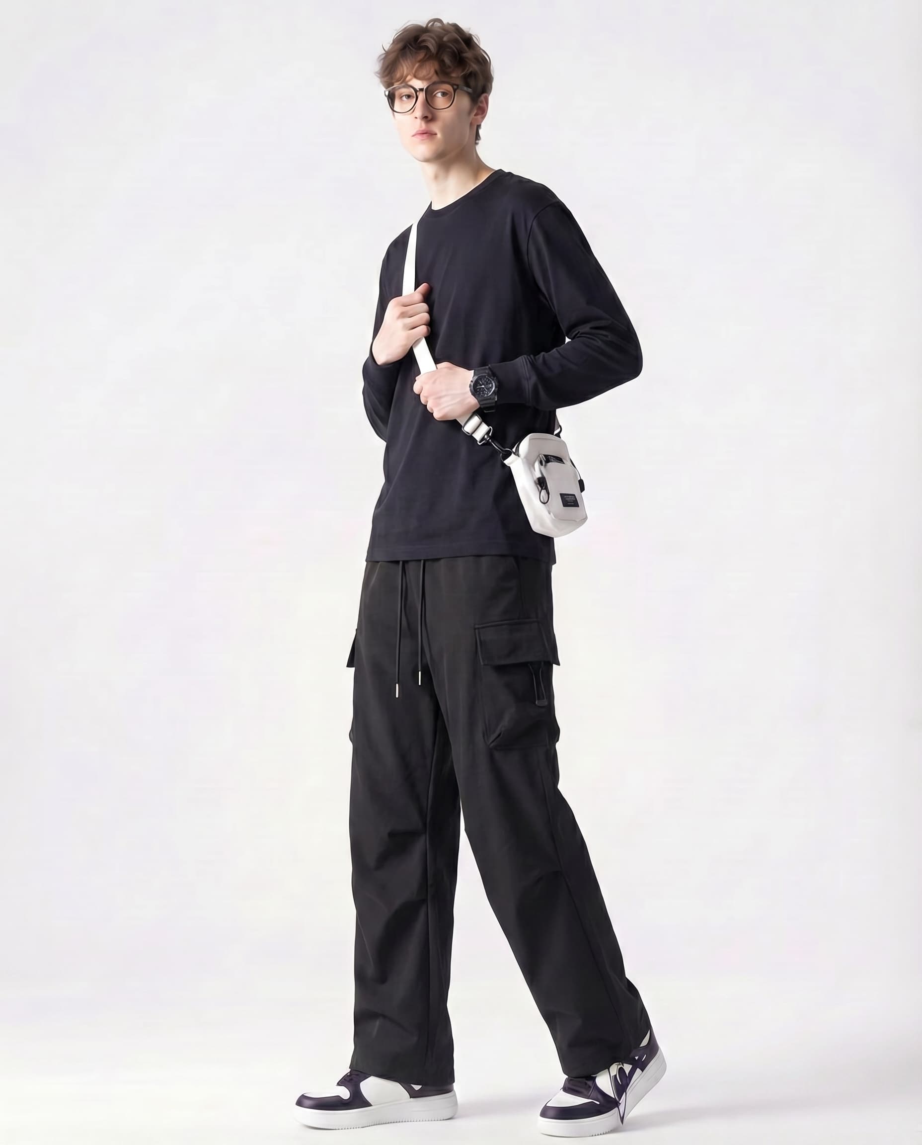 Tall man stretching in black straight fit vintage cargo pants showing flexibility and fit
