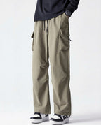 Khaki straight fit vintage cargo pants front view showing cargo pockets on tall model