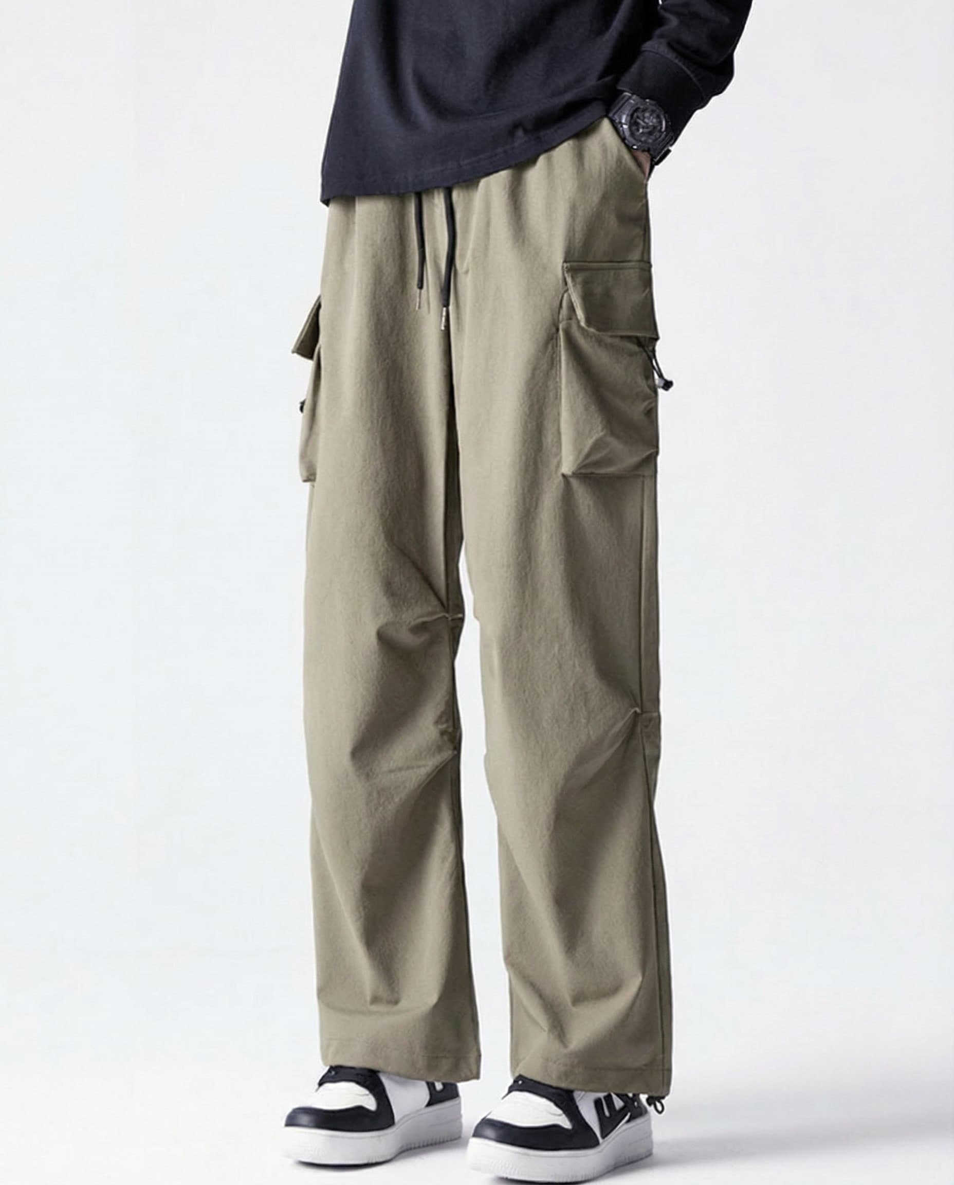 Khaki straight fit vintage cargo pants front view showing cargo pockets on tall model