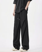 Black breezy wide-leg pants for tall men, full-length side view with relaxed casual styling
