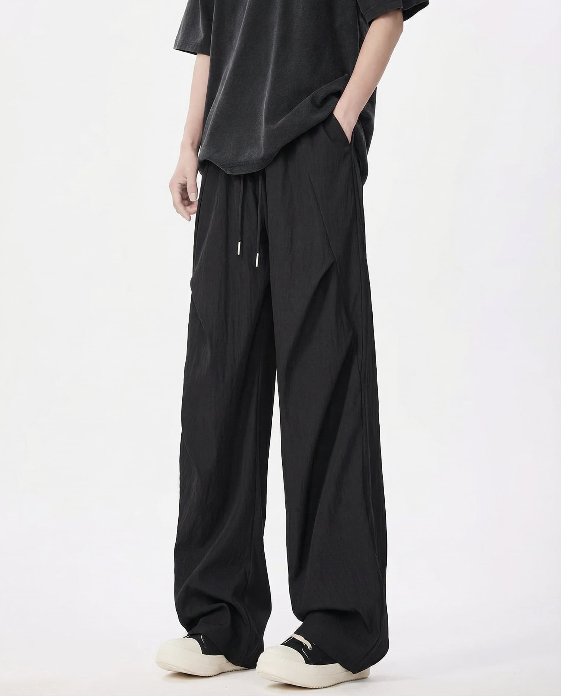 Black breezy wide-leg pants for tall men, full-length side view with relaxed casual styling
