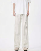 White breezy wide-leg pants for tall men, front view with minimalist clean aesthetic
