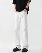 Tall men's white classic jeans, side profile view showing straight-leg cut and fabric drape