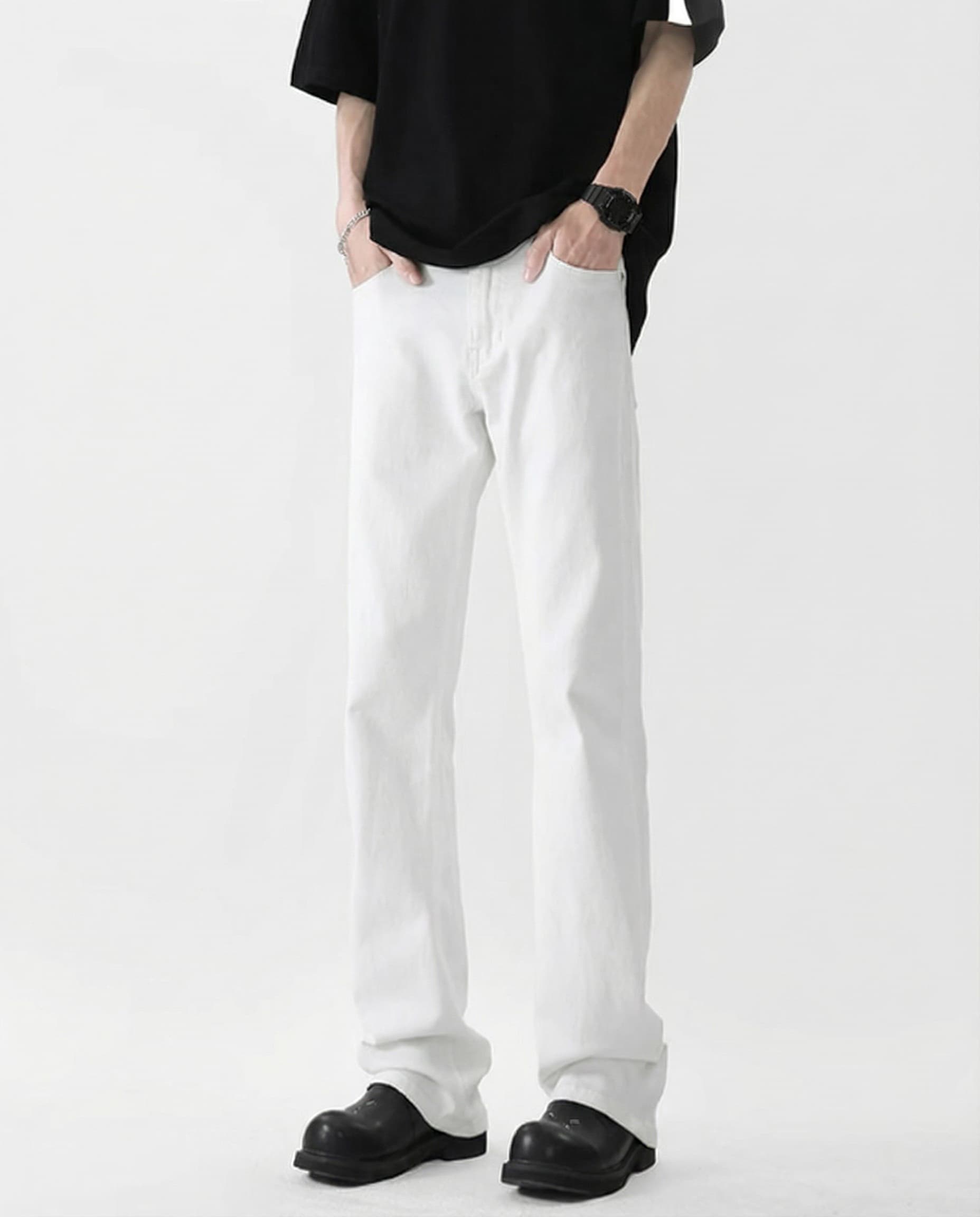 Tall men's white classic jeans, side profile view showing straight-leg cut and fabric drape