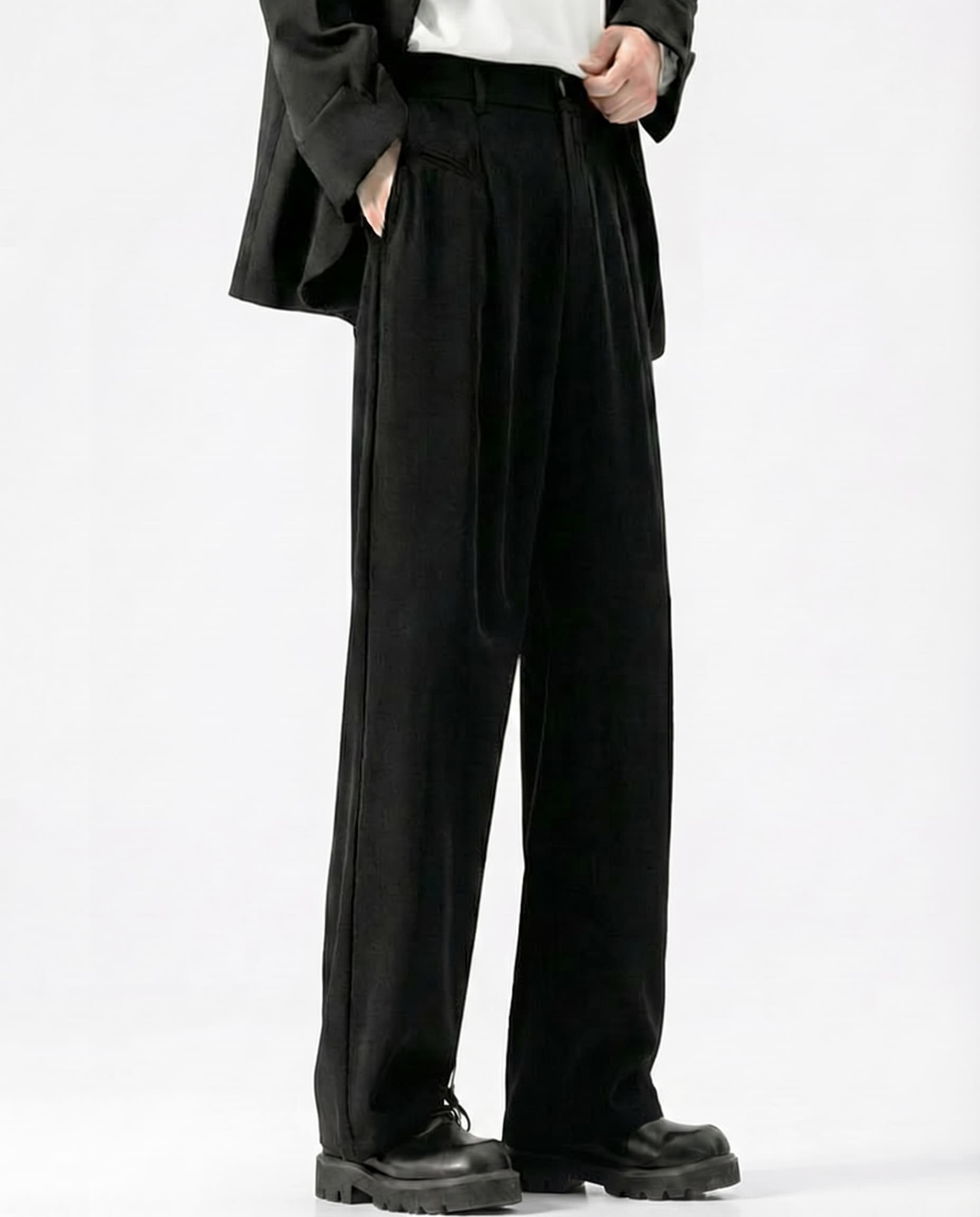 Men's black crinkle trousers in relaxed straight fit, styled with oversized jacket
