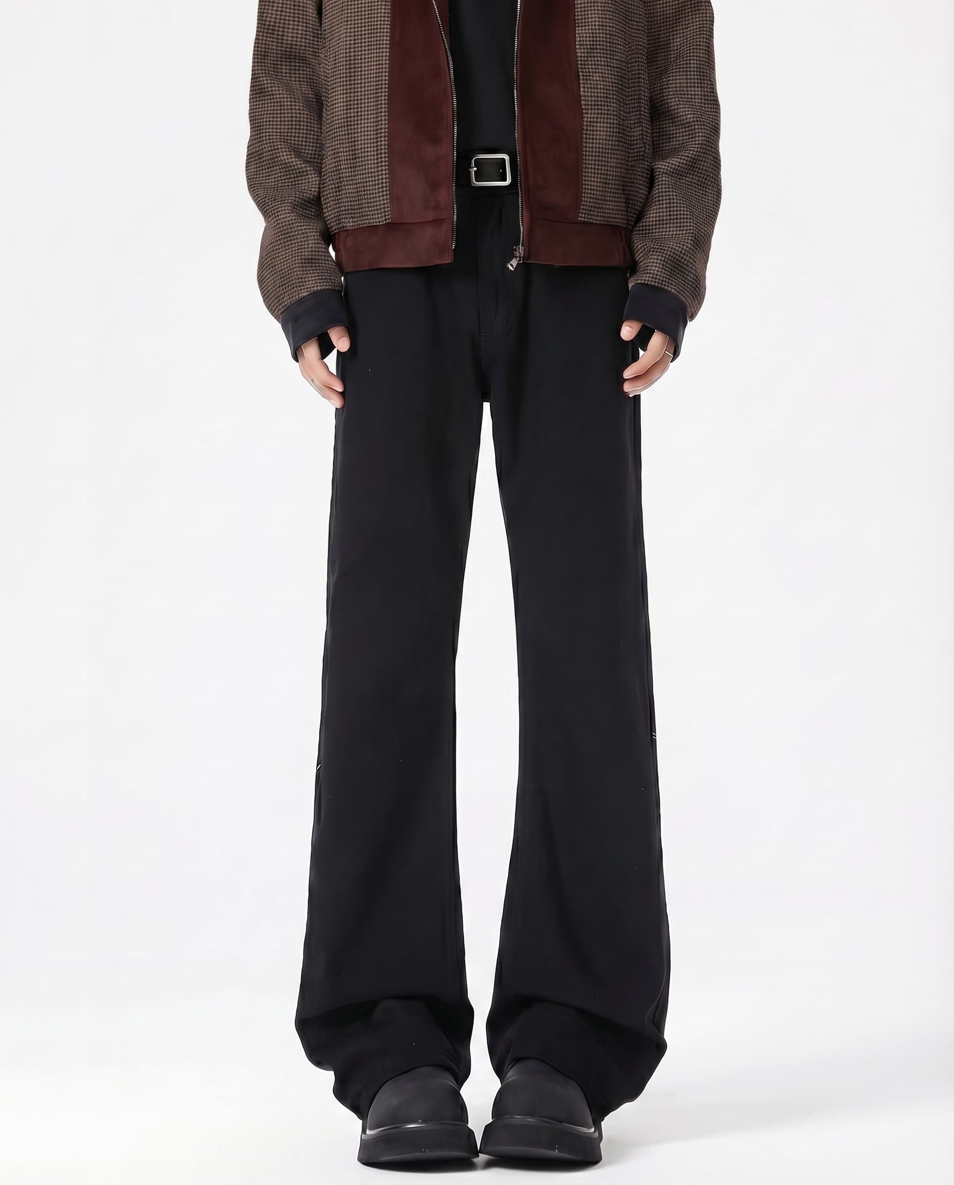 Tall men's black mid rise flare jeans, front view highlighting flared leg silhouette and length