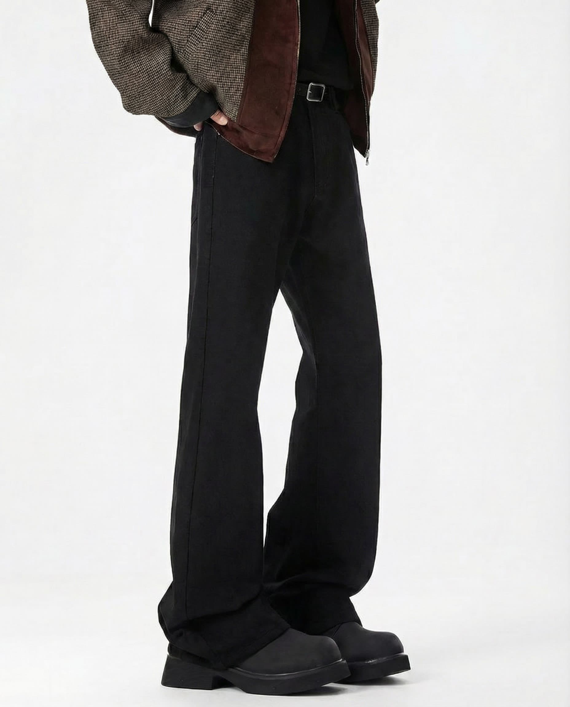 Black mid rise flare jeans for tall men, full-length view styled with brown bomber jacket