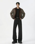Tall men's black flare jeans, showing mid rise waist and flared leg opening