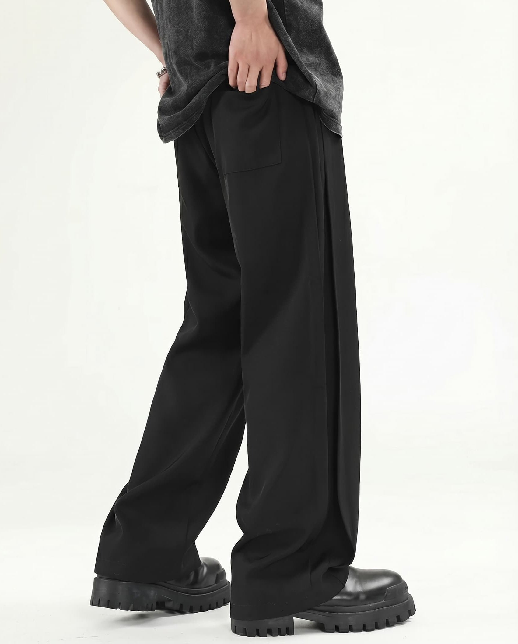 Black wide leg pleated pants for tall men, back view showing full-length proportion and relaxed fit