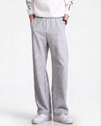 Grey pull-on straight leg sweatpants for tall men, full-length side view with casual white sneaker styling