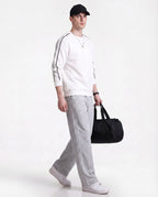 Grey straight leg sweatpants for tall men styled with bag, casual streetwear full outfit look