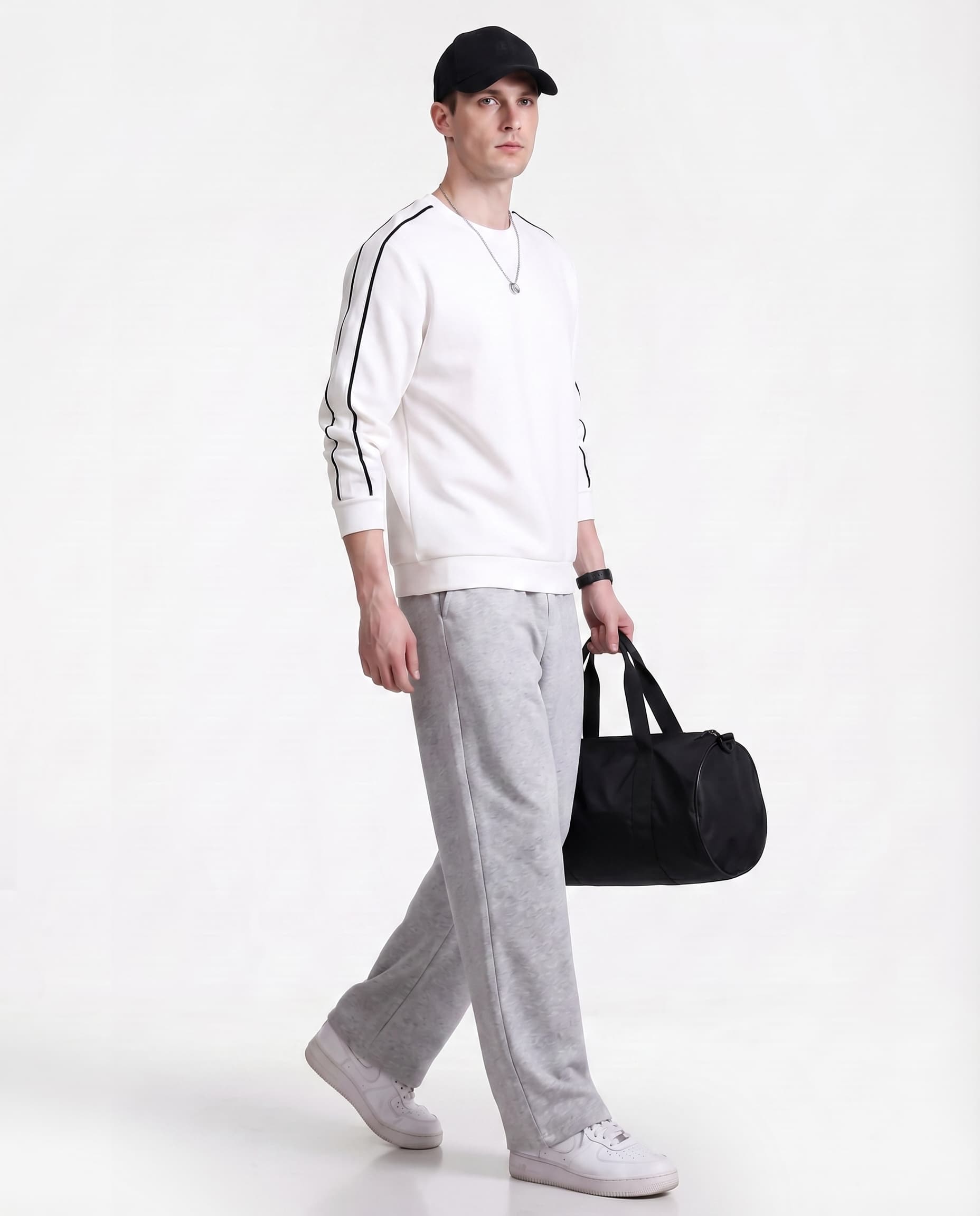 Grey straight leg sweatpants for tall men styled with bag, casual streetwear full outfit look
