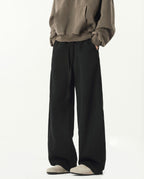 Black weekender stretch lounge sweatpants for tall men, front view with clean minimal styling