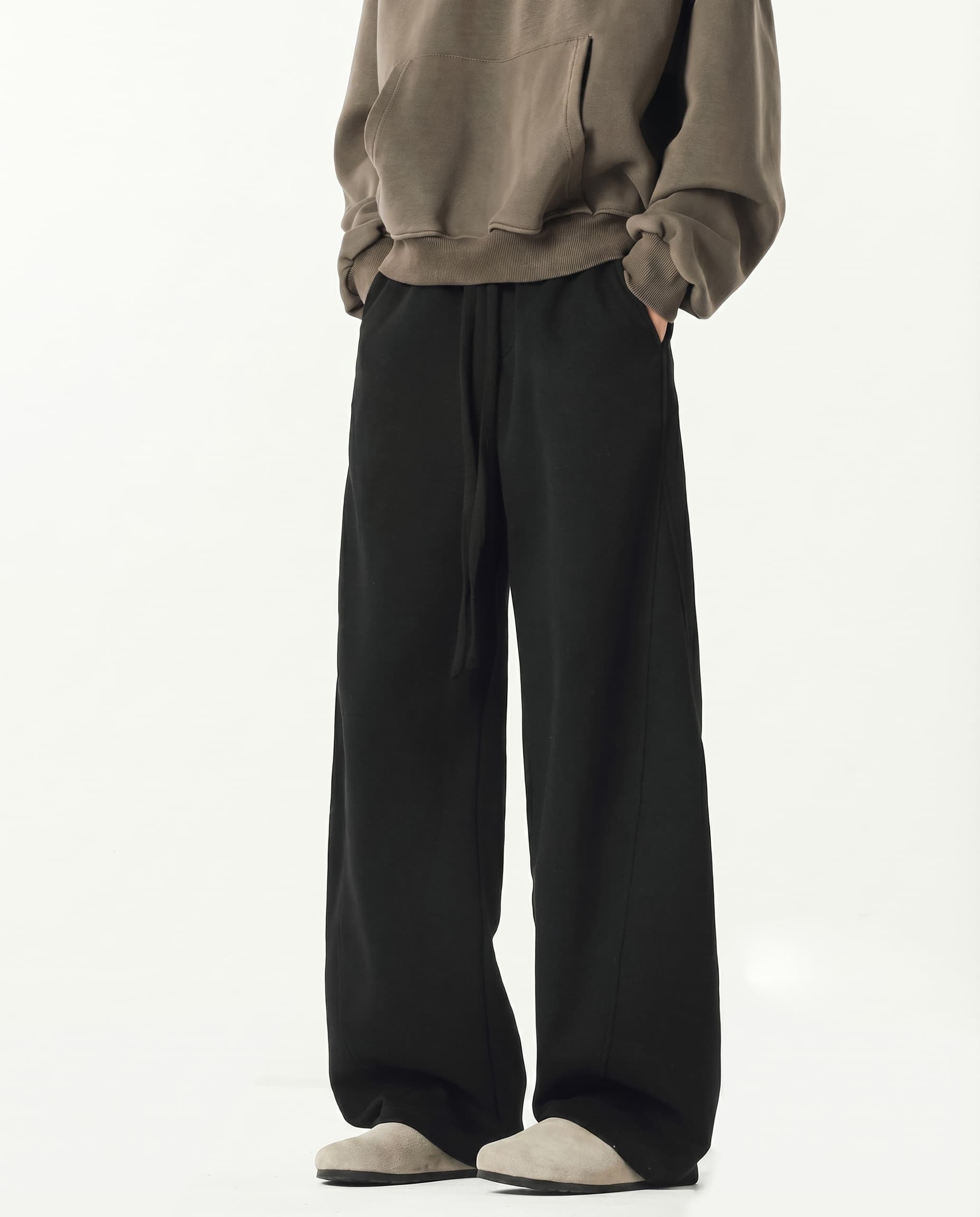 Black weekender stretch lounge sweatpants for tall men, front view with clean minimal styling