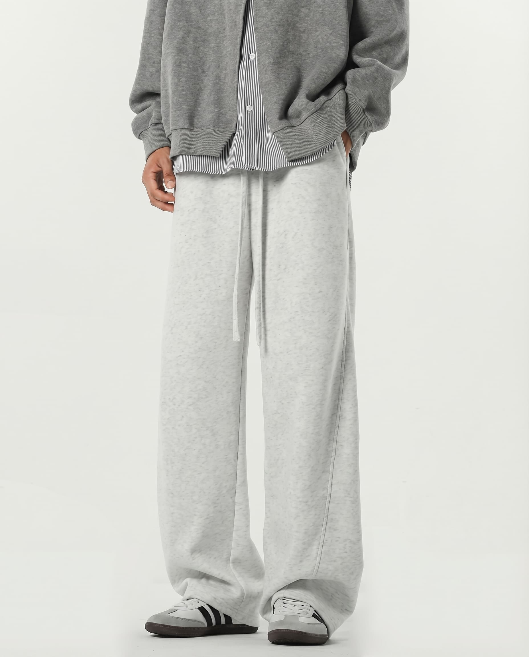 White weekender stretch lounge sweatpants for tall men, front view showing relaxed wide-leg silhouette