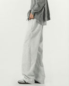 Close-up side detail of gray weekender sweatpants for tall men, elastic waistband and stretch fabric texture