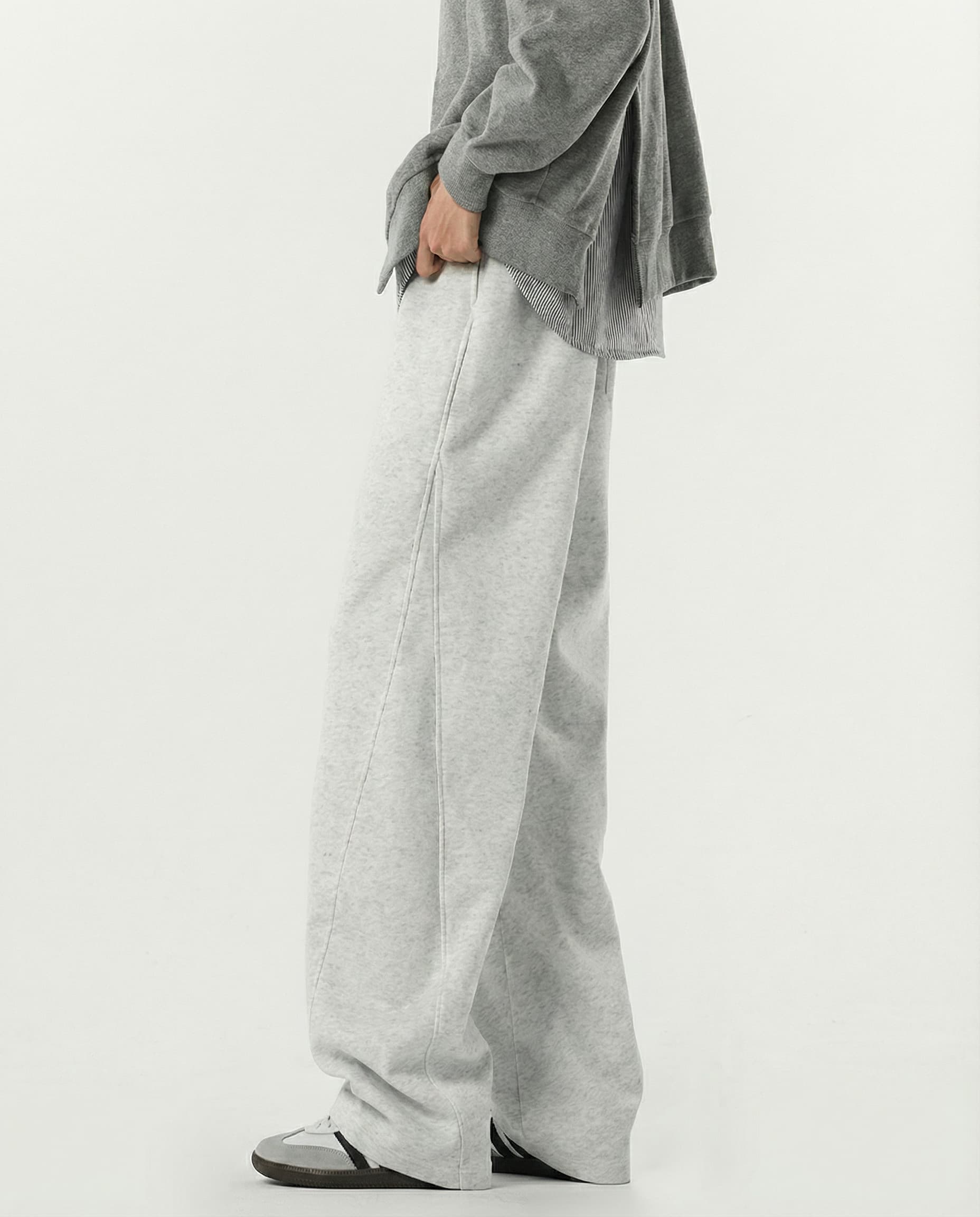 Close-up side detail of gray weekender sweatpants for tall men, elastic waistband and stretch fabric texture