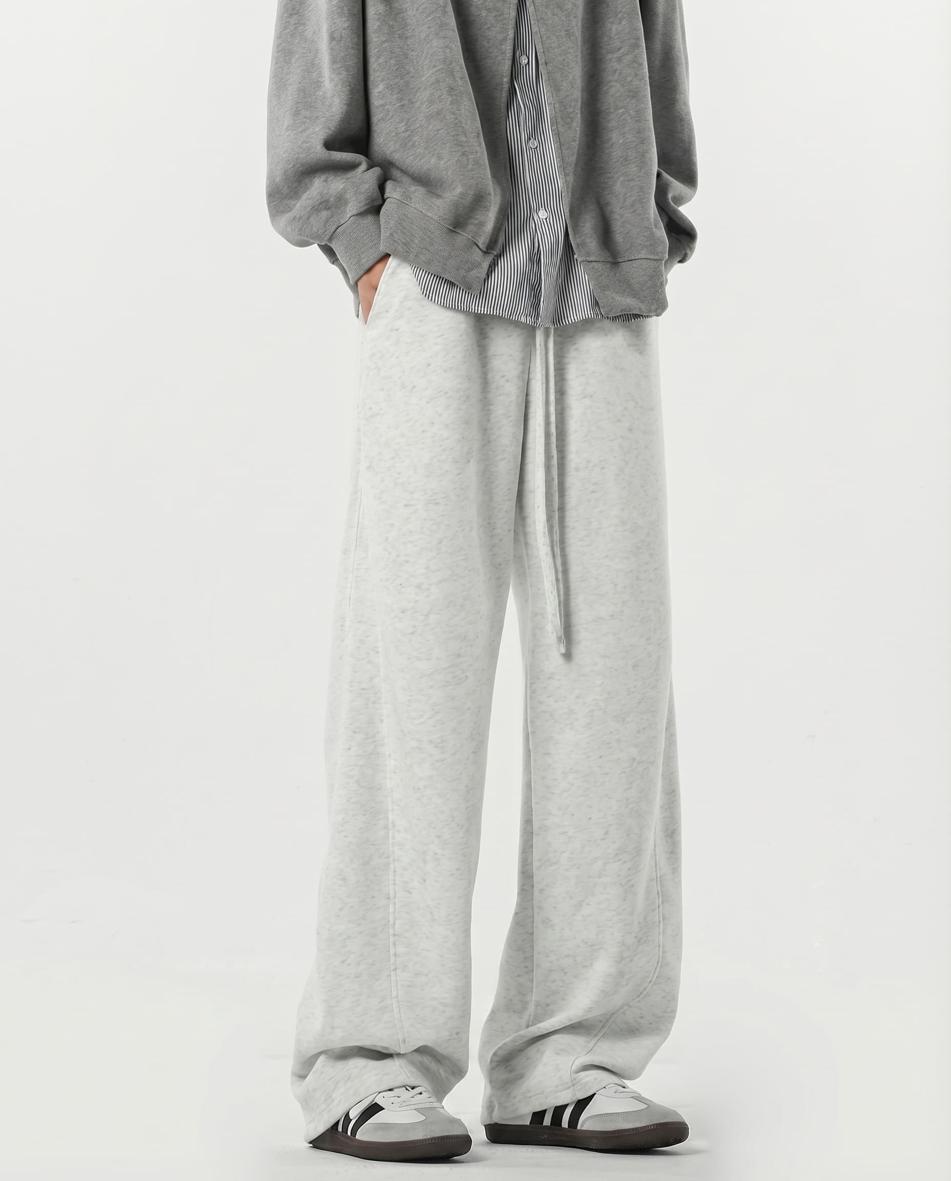 White stretch lounge sweatpants for tall men styled with brown jacket, layered casual outfit look